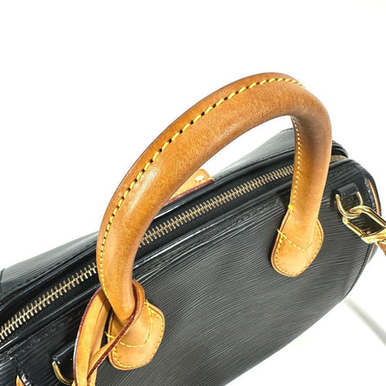 Louis Vuitton pre-owned black leather bag with distinct gold detailing and sturdy handles