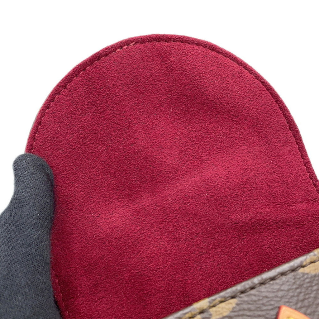 Detailed view of pre-owned Louis Vuitton Chantilly bag highlighting rich suede interior and iconic design