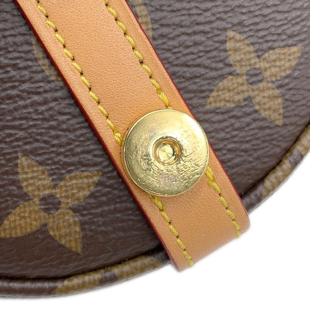 Close-up of the strap detailing on a pre-owned Louis Vuitton Chantilly bag with a gold clasp
