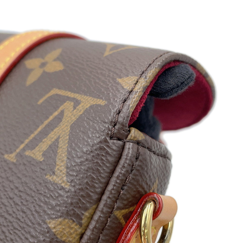 Side view of a pre-owned Louis Vuitton Chantilly bag featuring iconic monogram canvas and leather accents