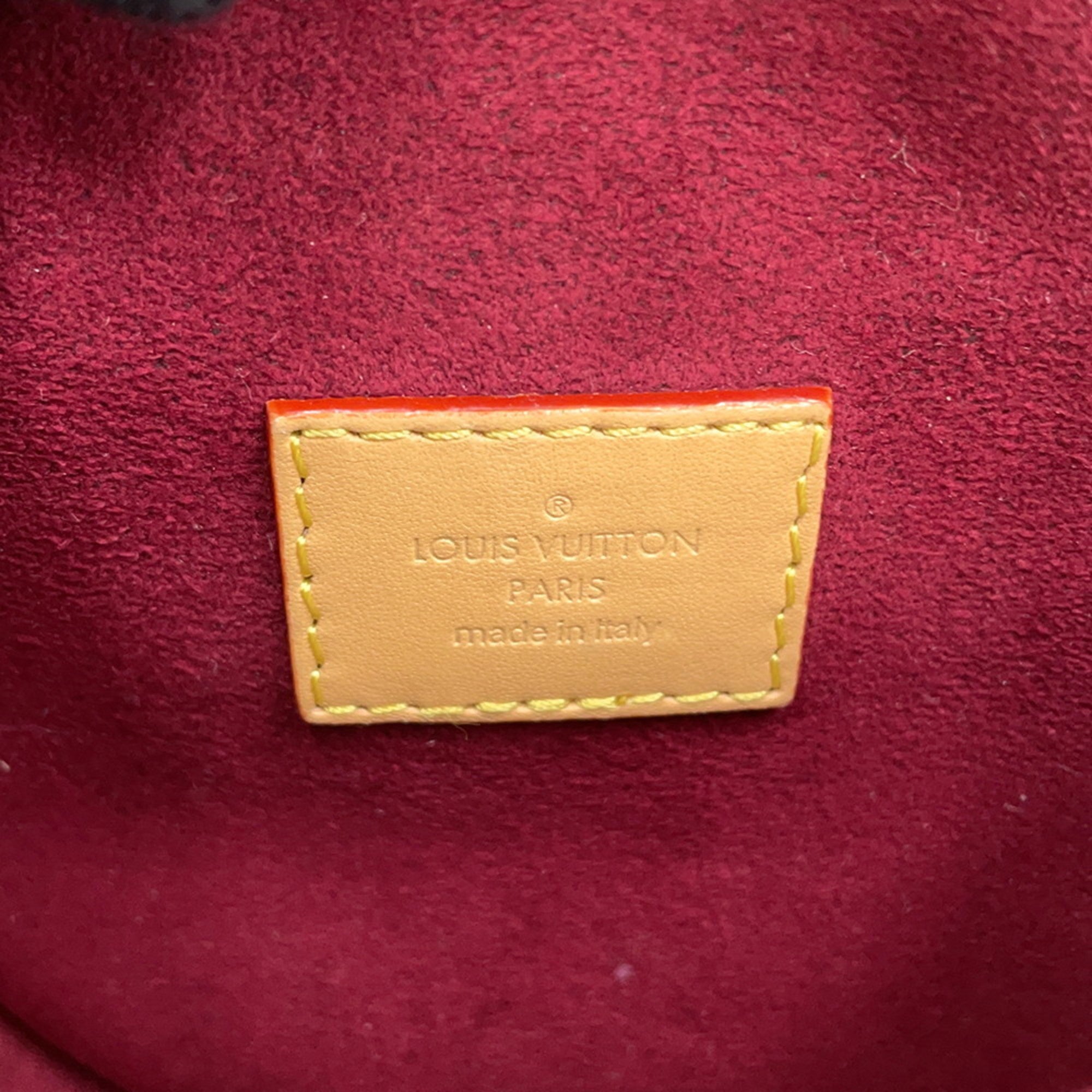 Interior detail of a pre-owned Louis Vuitton Chantilly bag showcasing the brand label made in Italy