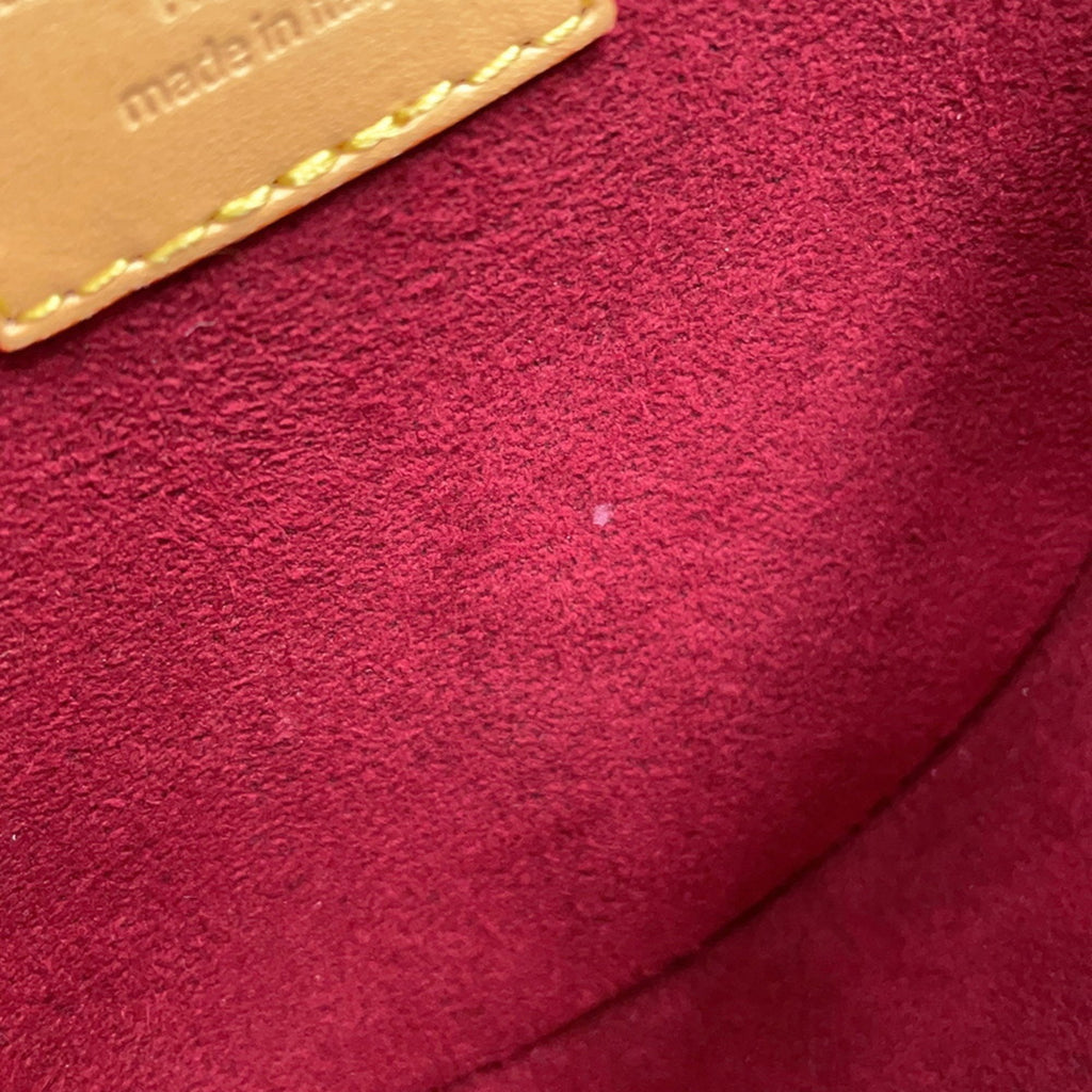 Interior view of a pre-owned Louis Vuitton Chantilly bag showcasing the soft suede material