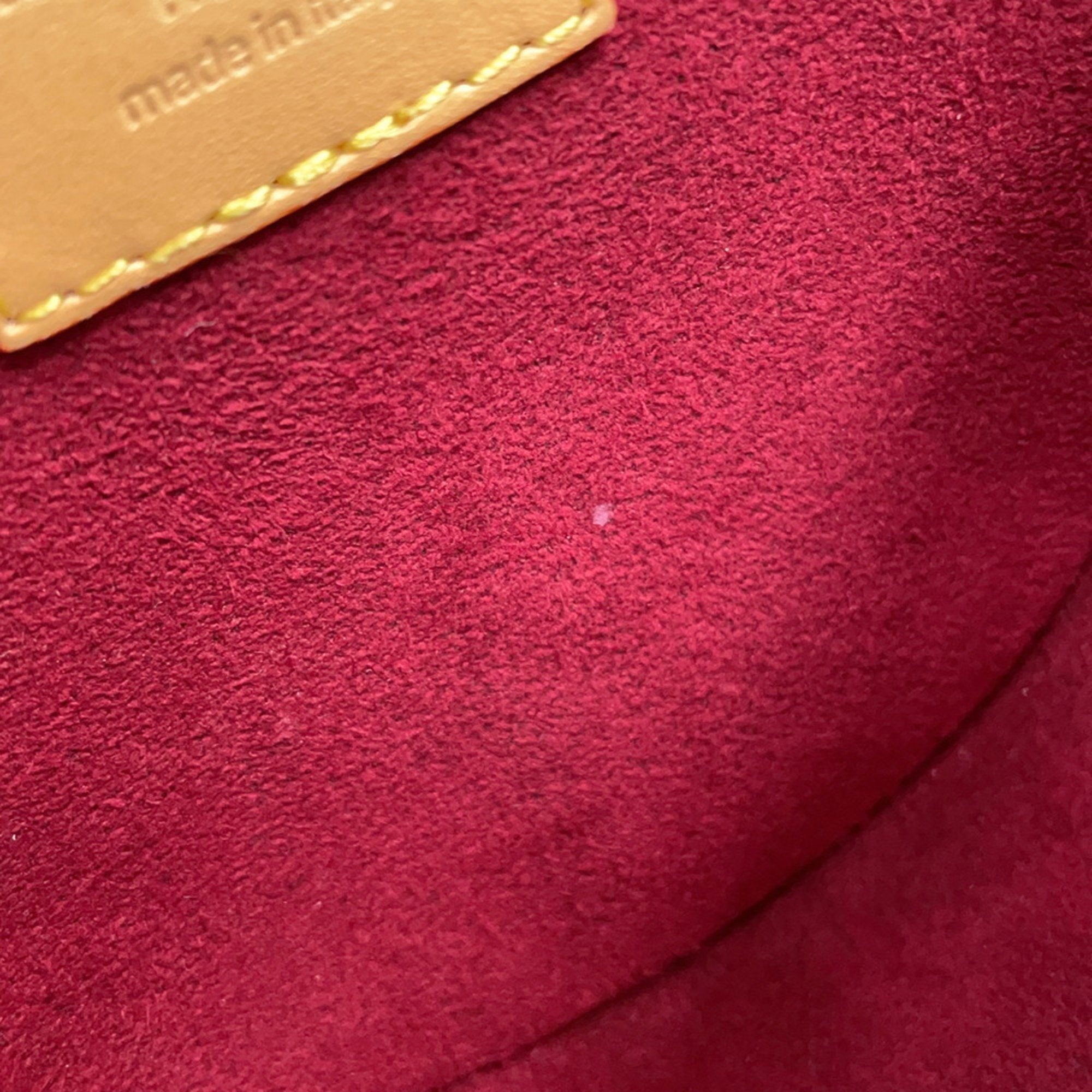 Interior view of a pre-owned Louis Vuitton Chantilly bag showcasing the soft suede material