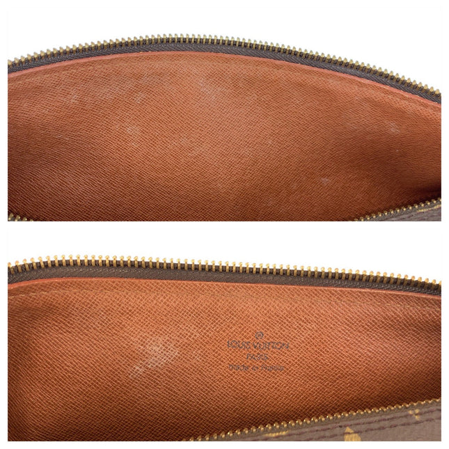 Interior view of a pre-owned Louis Vuitton bag showcasing a clean orange lining and gold zipper detail