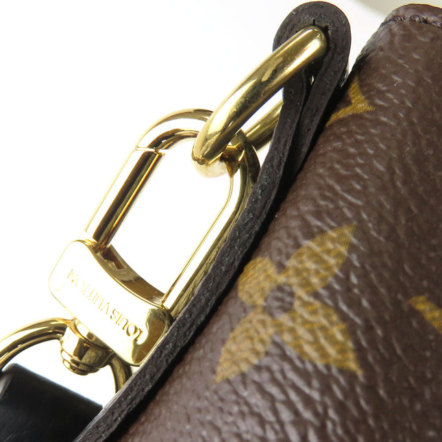 Close-Up of Pre-Owned Louis Vuitton Bag Showing Gold Hardware and Iconic Monogram Pattern