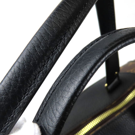 Close-up of the handle on a Pre-Owned Louis Vuitton bag showcasing the quality leather craftsmanship