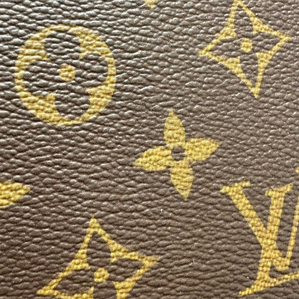 Close-up of Pre-Owned Louis Vuitton bag featuring iconic monogram pattern and durable leather texture