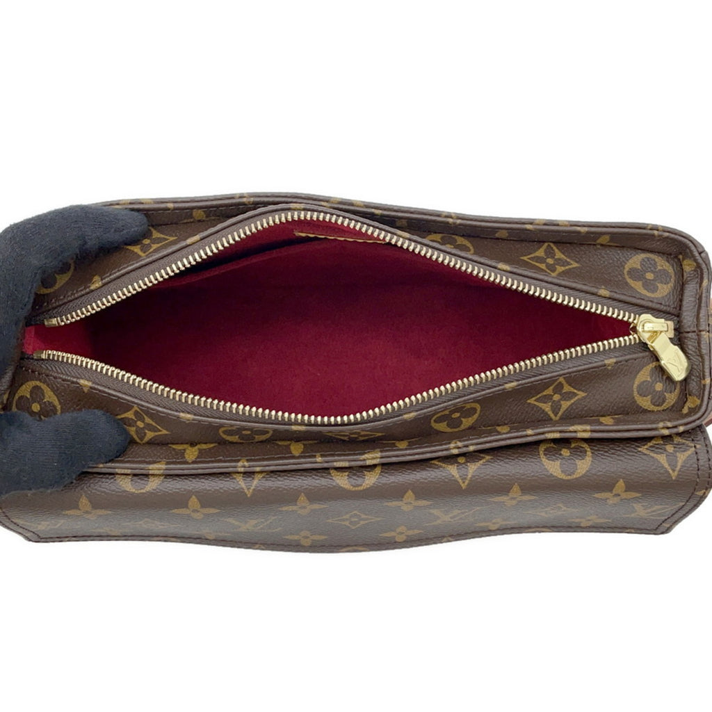 MANSII Louis Vuitton Cosmetic Bag used like new with a red interior and zip closure
