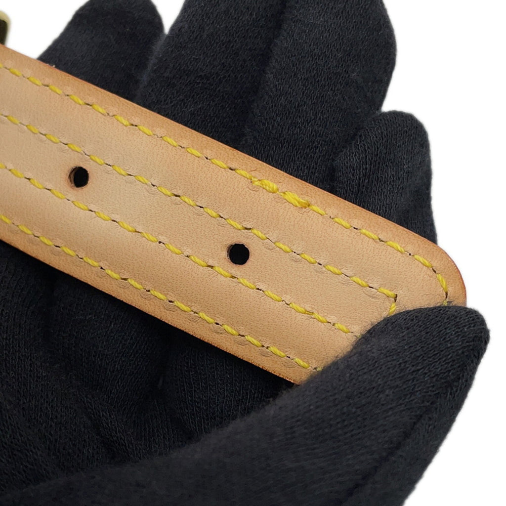 MANSII leather strap in tan color, used like new, showcasing quality stitching on a hand model