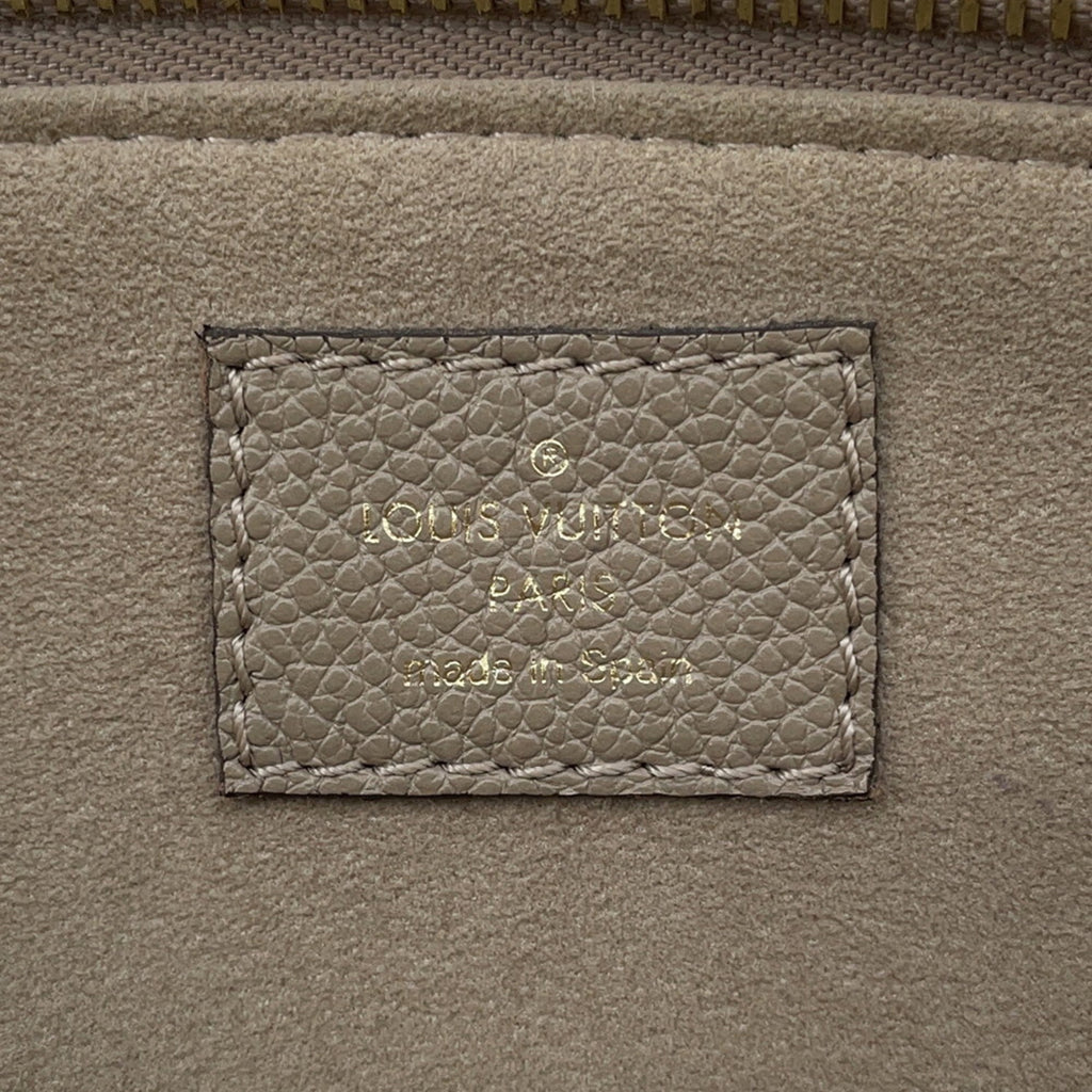 Interior label of LOUIS VUITTON used Petit Palais PM handbag showing brand details and craftsmanship