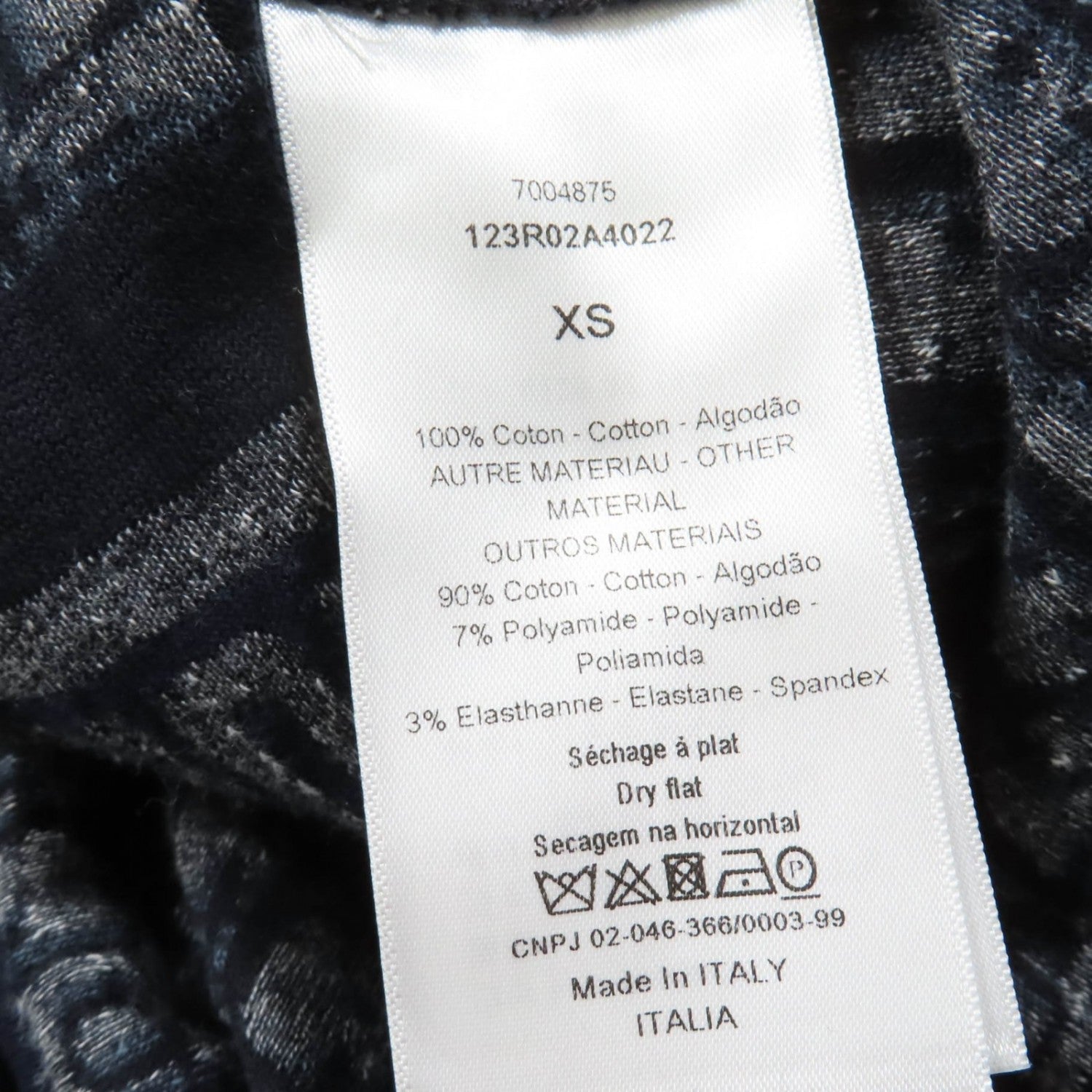 Care label of luxury secondhand Dior womenswear showing fabric composition and care instructions