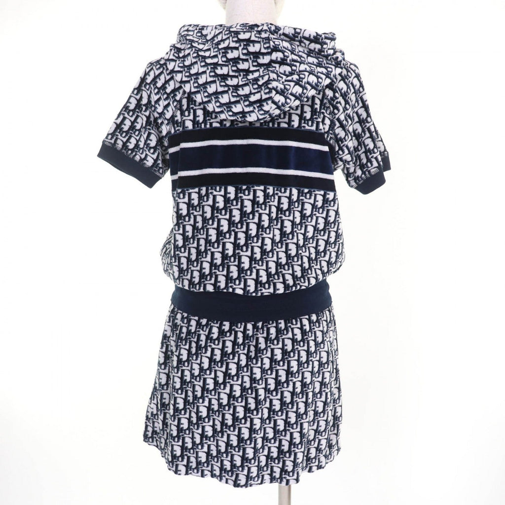 Luxury secondhand Dior womenswear featuring a stylish hooded top and matching skirt in blue and white