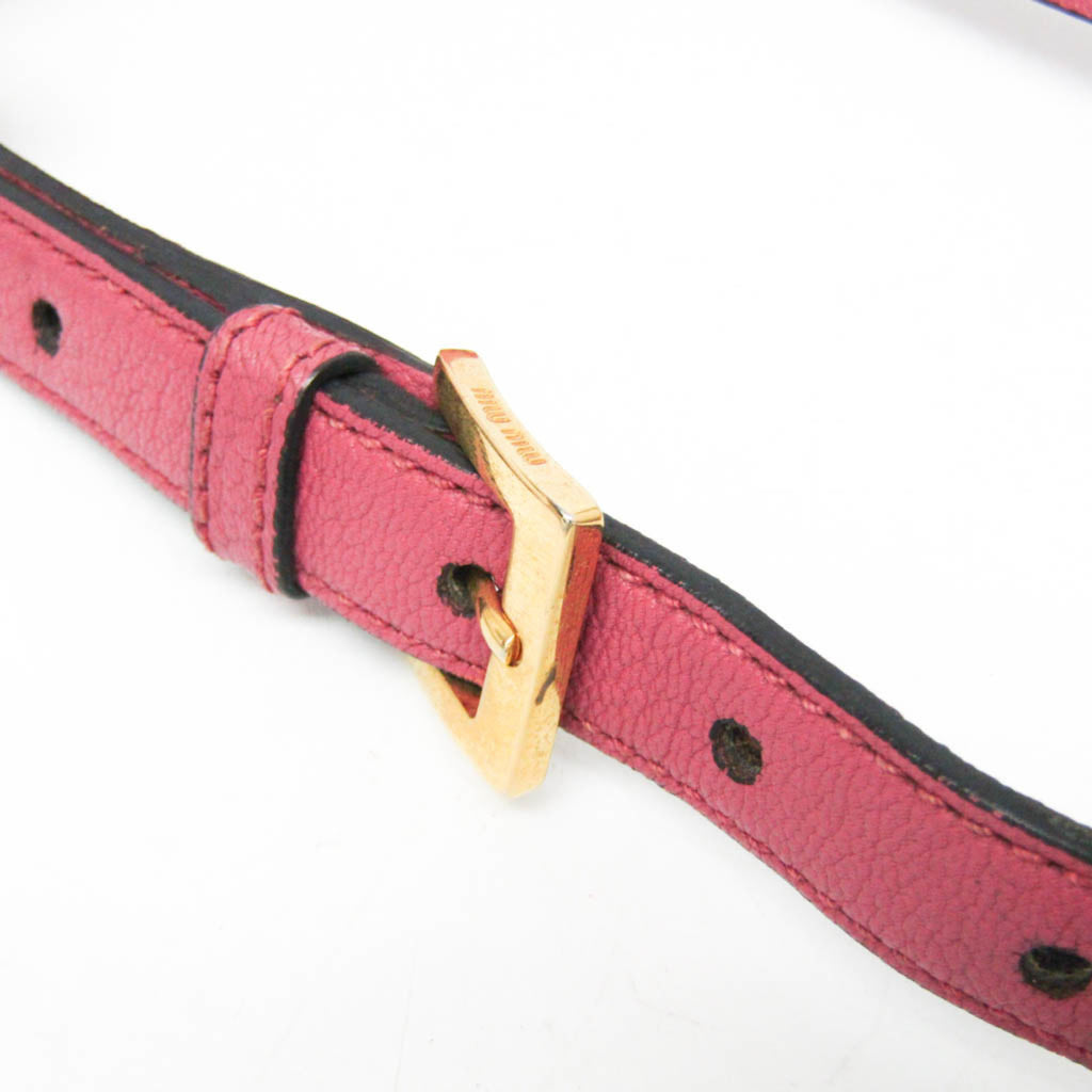 Close-up of the strap detail on MIU MIU Pre-Loved MADRAS shoulder bag featuring a gold buckle and textured leather