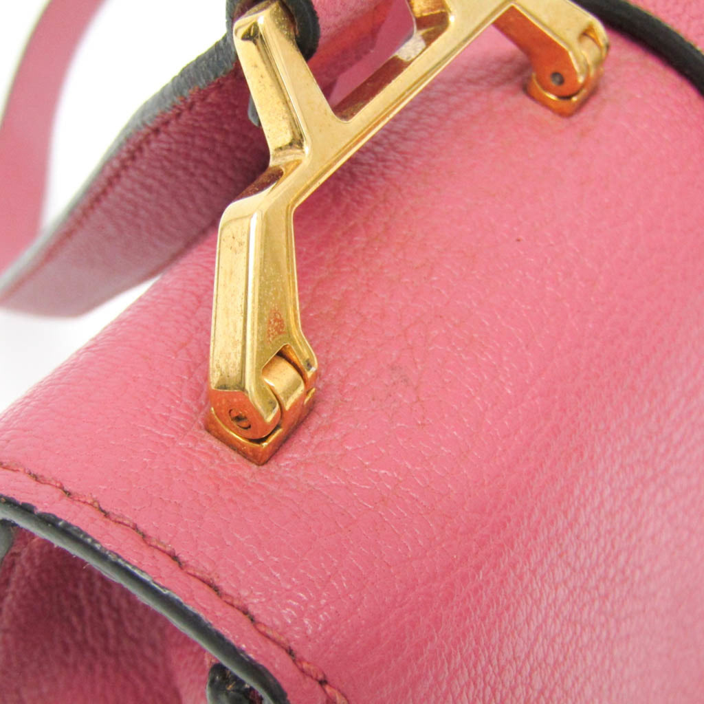 Close-up of MIU MIU Pre-Loved MADRAS shoulder bag in pink leather with gold hardware detail