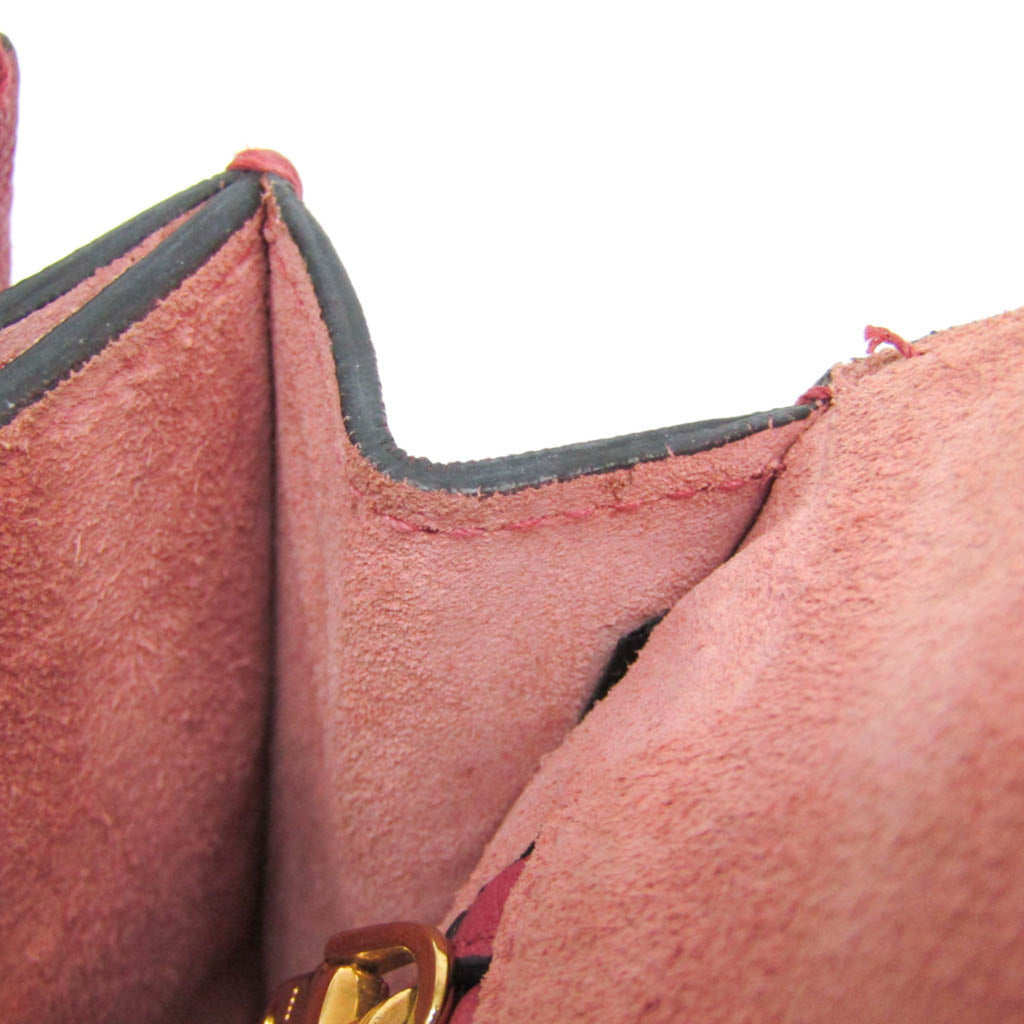 Inside view of MIU MIU Pre-Loved MADRAS shoulder bag showing soft pink suede lining and spacious compartments