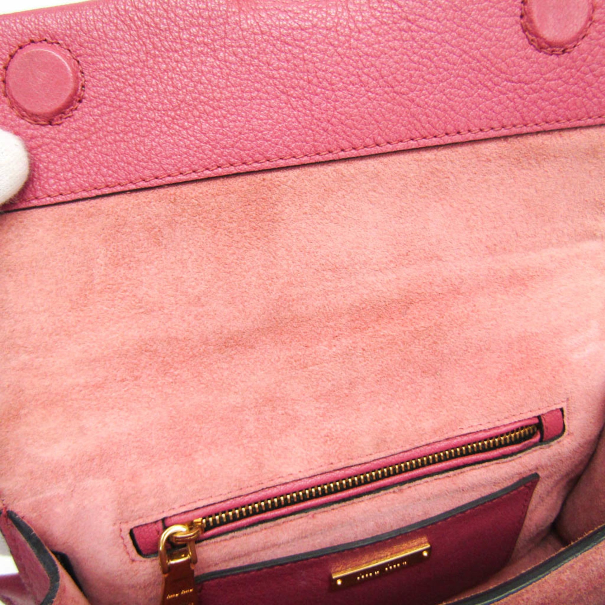 Interior view of the MIU MIU Pre-Loved MADRAS shoulder bag featuring a zip pocket and soft lining