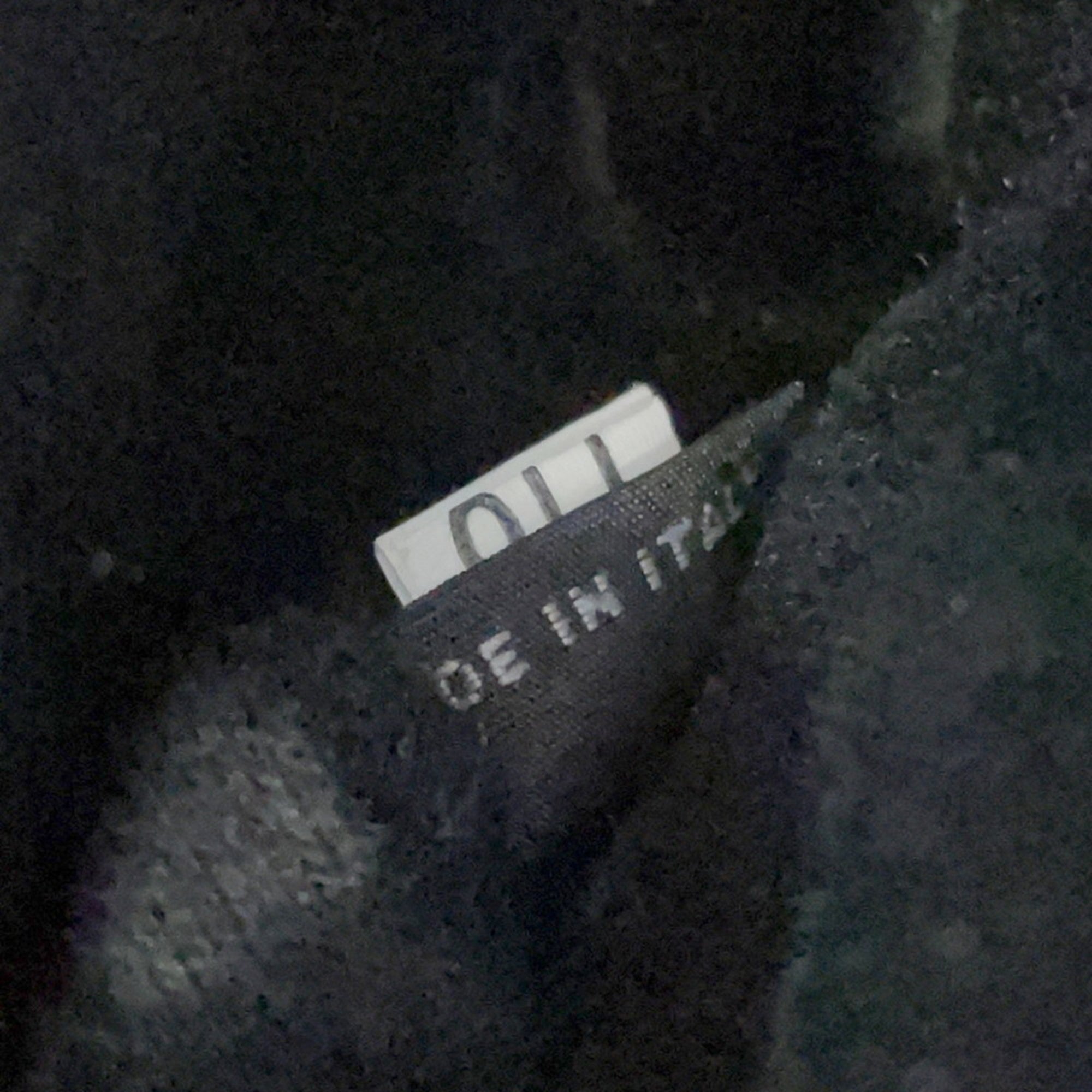 MIU MIU Pre-Loved Swallow Pattern Bag tag showing Made in Italy for authenticity