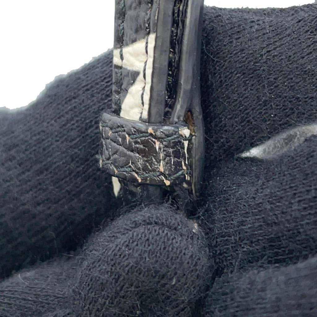 Close-up of MANSII MIU MIU Pre-Loved Swallow Pattern Bag showing detailed craftsmanship and wear