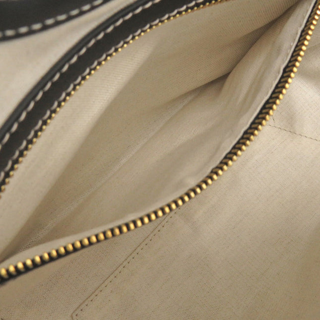 Interior view of a MIU MIU pre-owned bag with spacious compartments and zipper closure