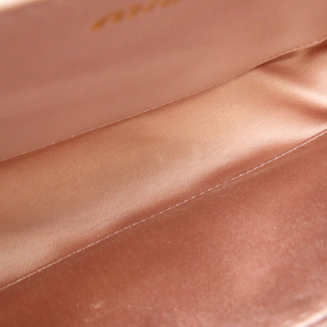 Interior view of a MIU MIU bag showing smooth satin lining in pre-owned condition