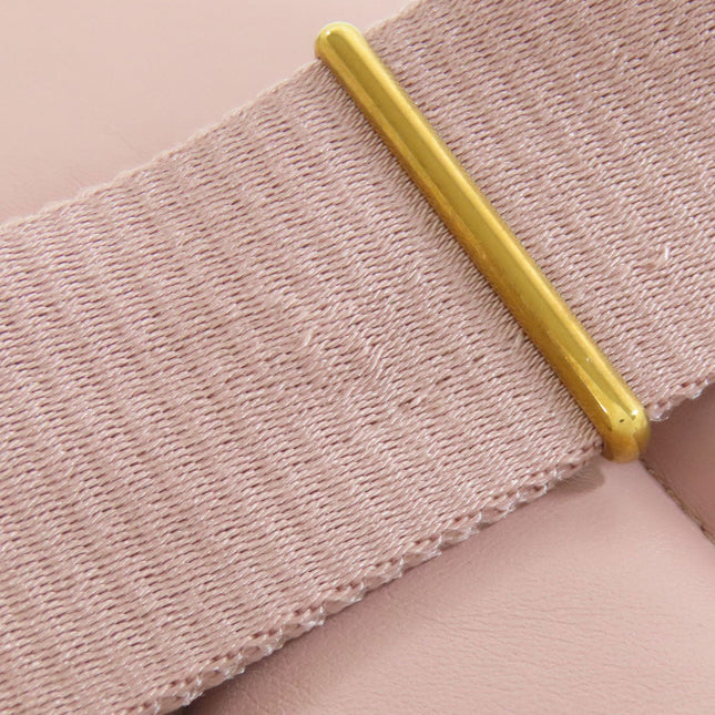 MIU MIU pre-owned bag detail showcasing beige fabric and gold accent for a chic look