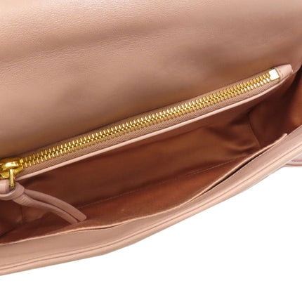 Interior view of MIU MIU pre-owned bag showing spacious compartment and gold zipper detail