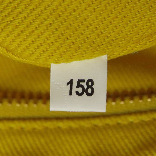 MIUMIU pre-owned bag tag with identification number 158 on a vibrant yellow fabric