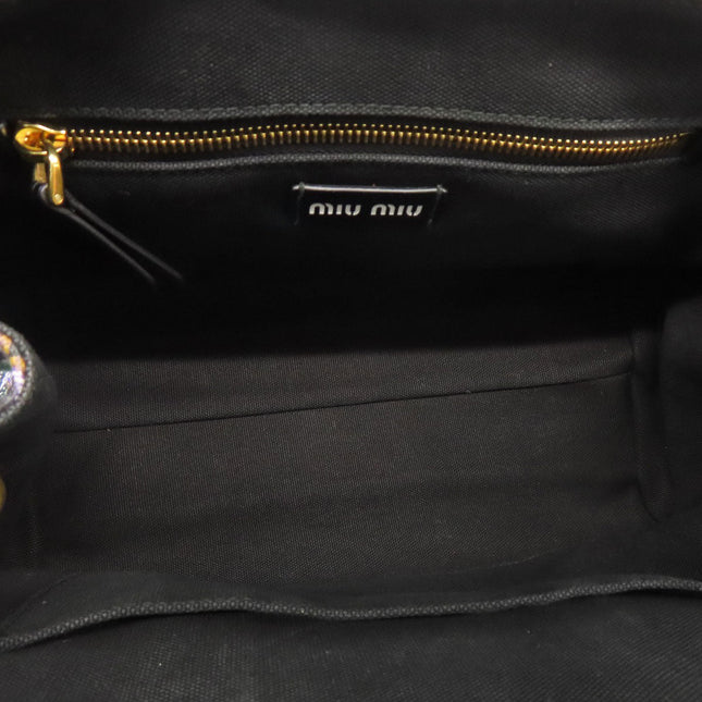 Inside view of MIU MIU Pre-Owned bag showcasing spacious compartment and gold zipper detailing