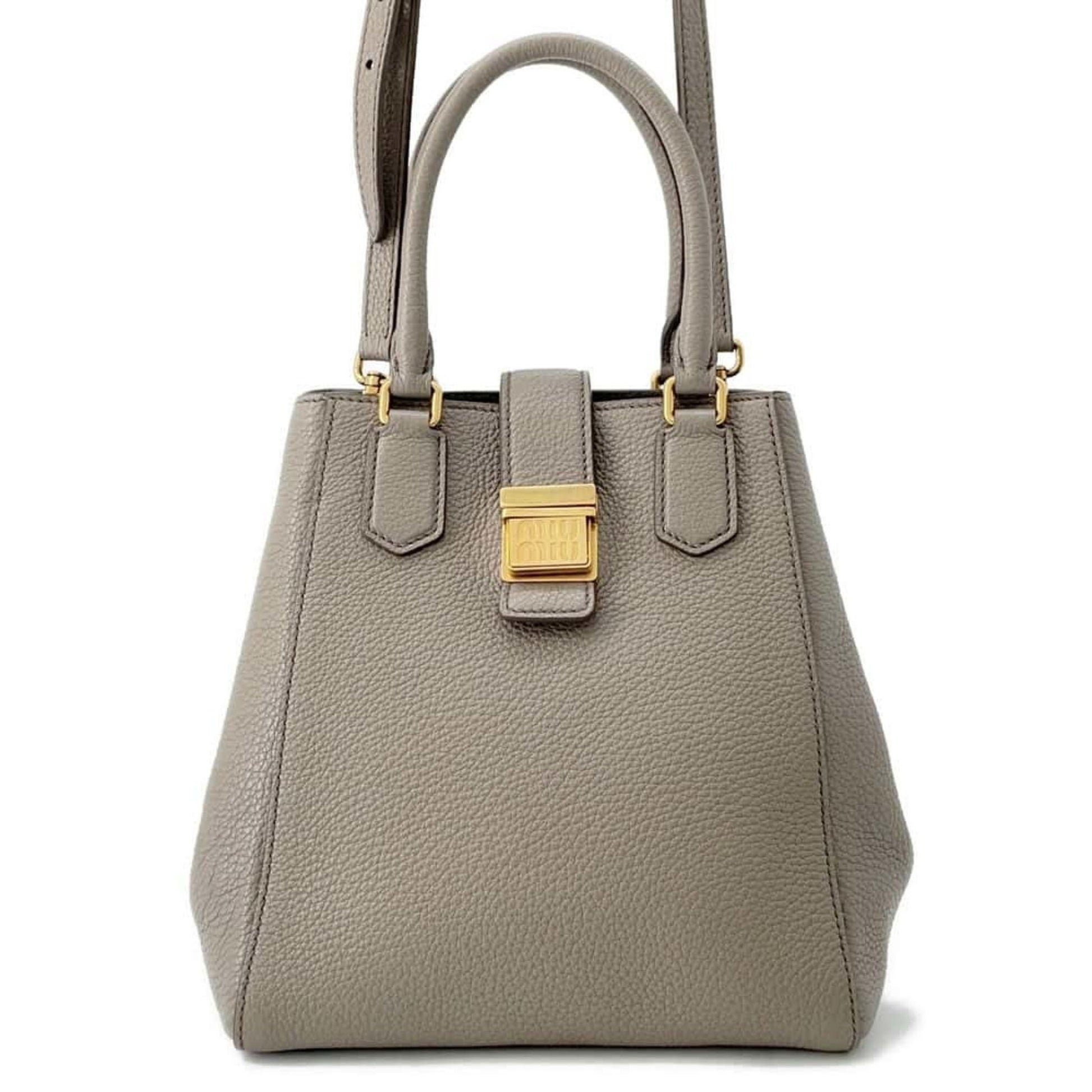 Miu Miu pre-owned handbag in gray leather with gold hardware and dual handles.