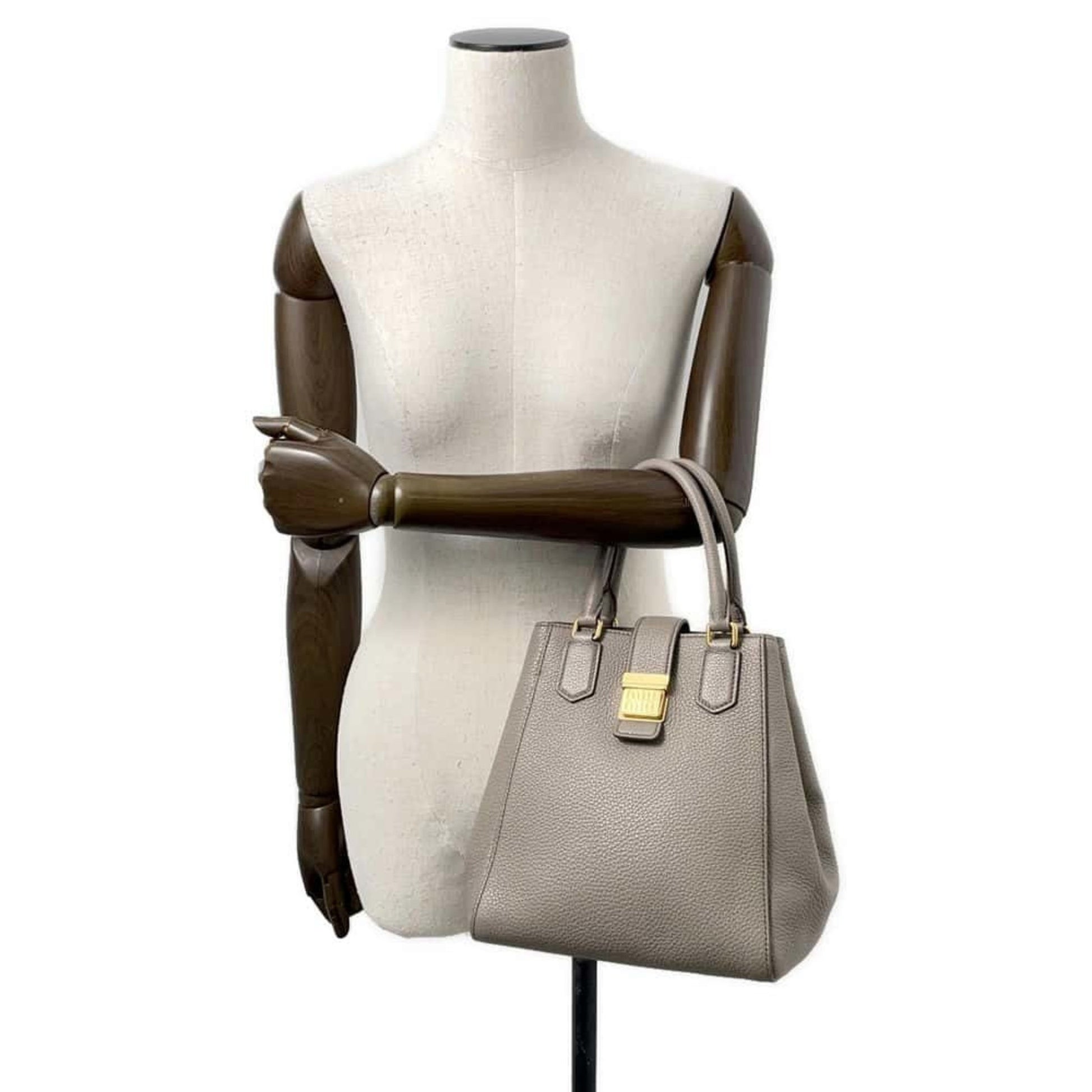 Miu Miu pre-owned gray leather handbag with structured design and gold-tone hardware