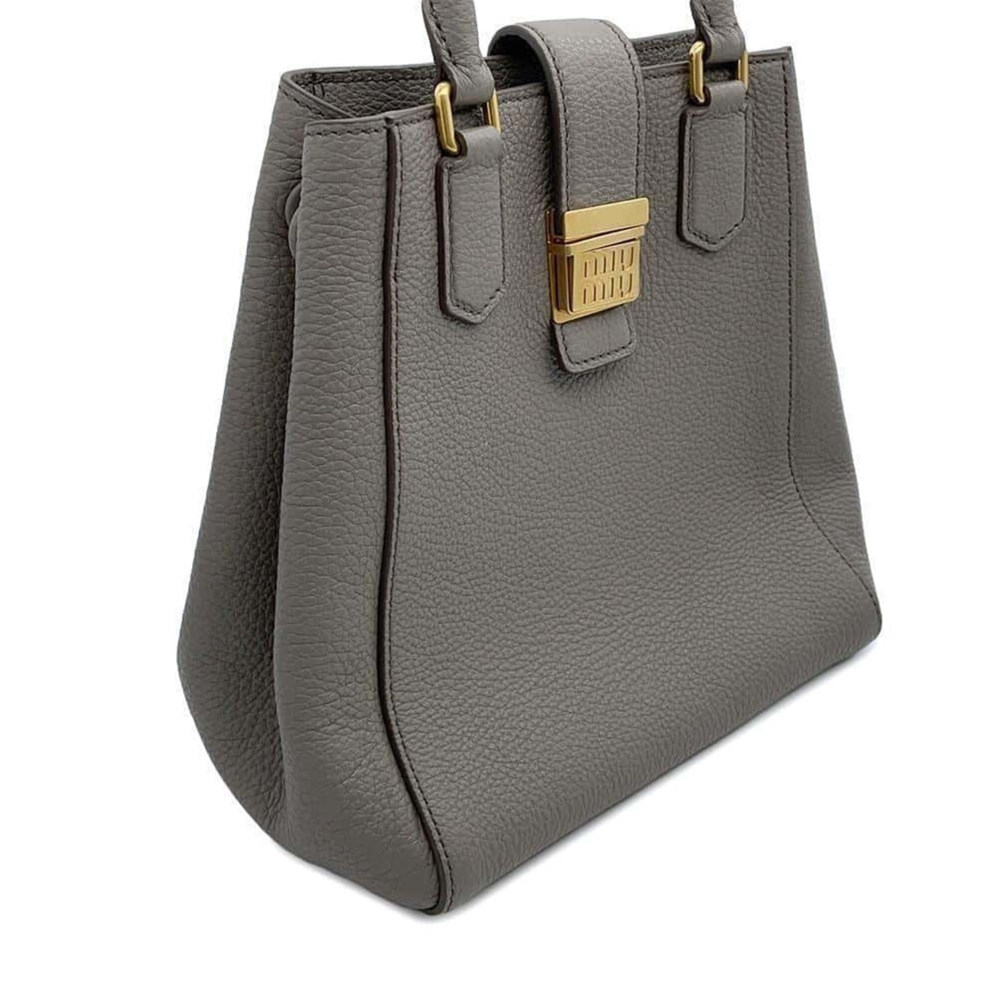Miu Miu pre-owned leather handbag in grey with a structured design and gold-tone hardware