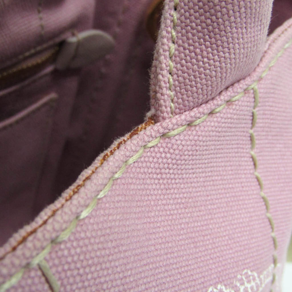 Close-up of the interior stitching of a PRADA Pre-Loved Canapa bag in soft pink fabric