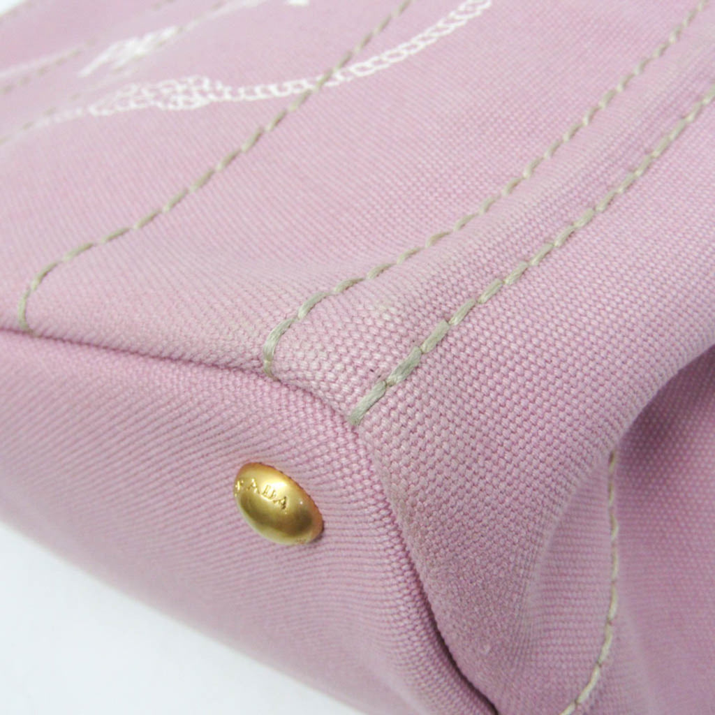 Close-up of PRADA Pre-Loved Canapa bag showcasing pink fabric and gold hardware detail