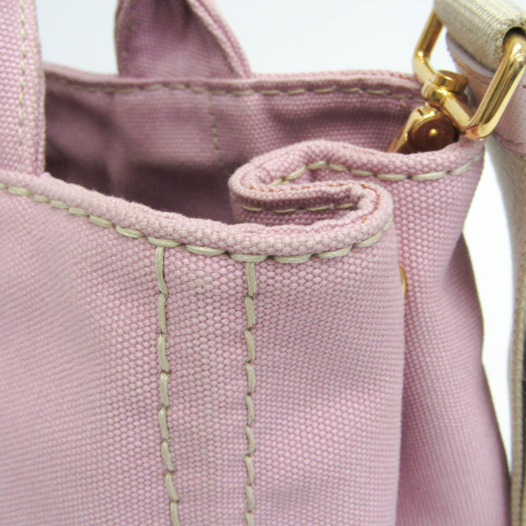 Close-up of PRADA Pre-Loved Canapa bag showing pink fabric and detailed stitching