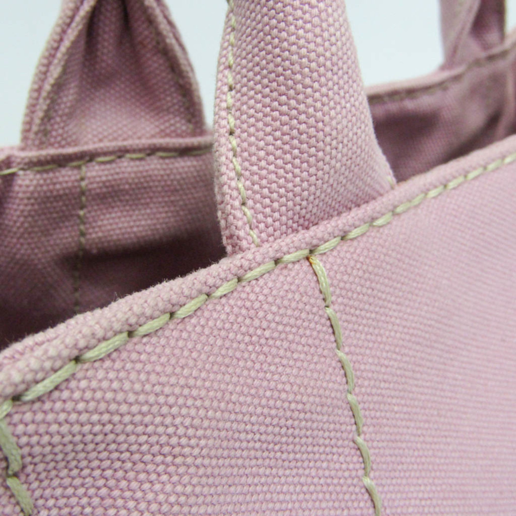 Close-up of Prada Pre-Loved Canapa bag detailing with stitched seams and textured fabric