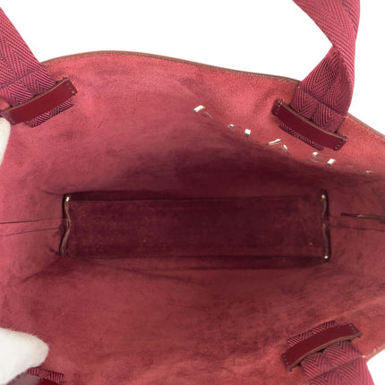 Interior view of a PRADA pre-owned bag showcasing its spacious design and luxurious lining