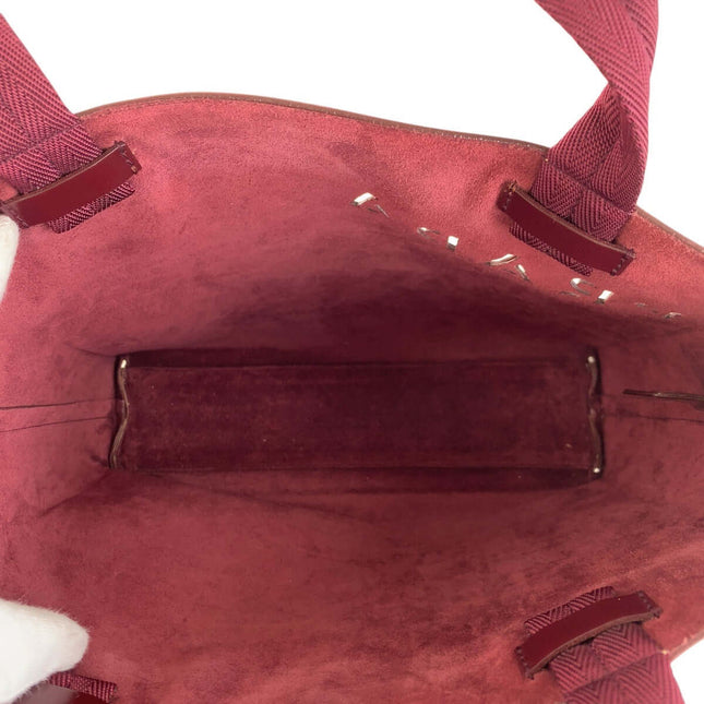 Interior view of a PRADA pre-owned bag showcasing its spacious design and luxurious lining