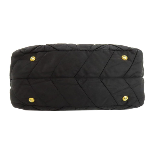 PRADA pre-owned black quilted bag with gold-tone hardware and chevron pattern design