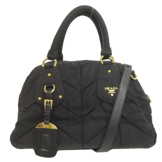 Pre-owned PRADA black quilted handbag with gold-tone accents and detachable strap