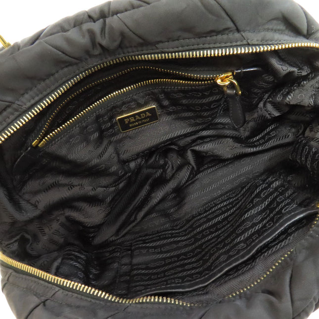 Pre-owned PRADA bag featuring a spacious interior with gold zip and logo lining