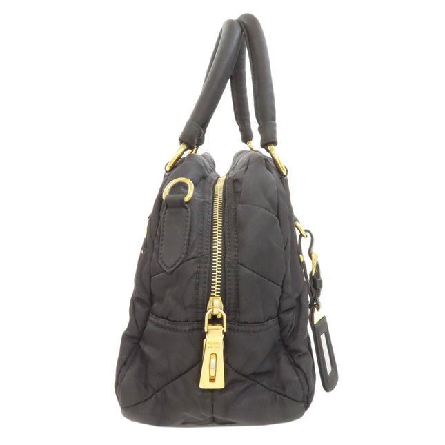 PRADA pre-owned black quilted bag with gold accents and zipper detail for stylish everyday use