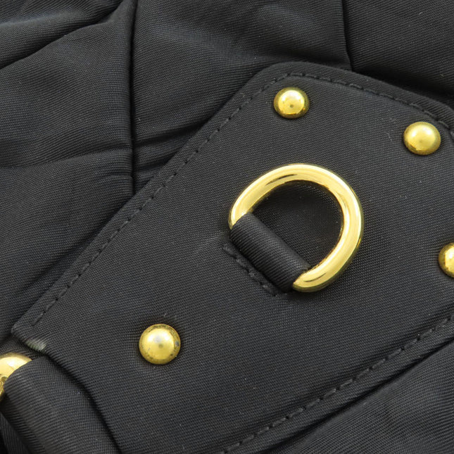 PRADA pre-owned handbag featuring stylish gold hardware and quilted fabric design