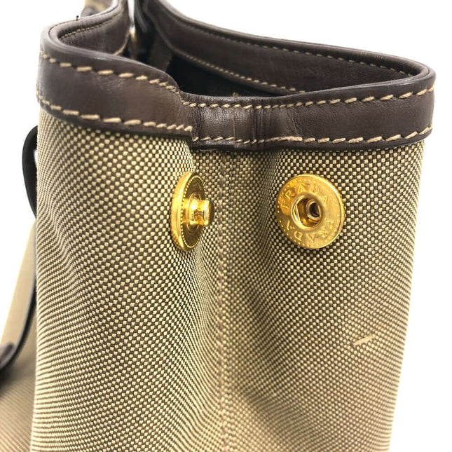 PRADA pre-owned bag featuring a textured exterior and signature hardware detail