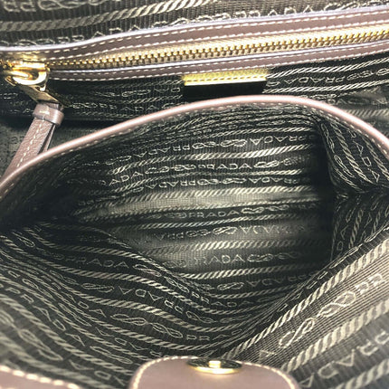Inside view of PRADA pre-owned bag with elegant fabric lining and multiple pockets