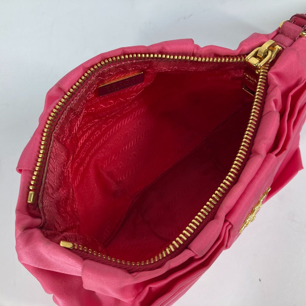 Inside view of a vintage pink PRADA bag with a spacious and elegant design