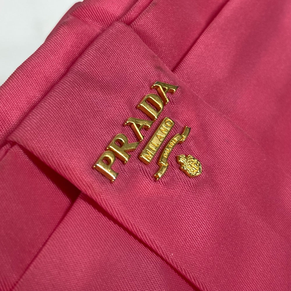 Vintage PRADA bag in pink with gold logo detailing for stylish, timeless fashion