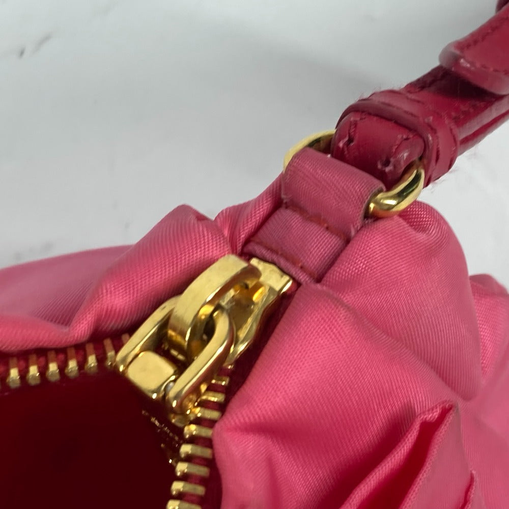 PRADA vintage pink bag featuring gold hardware and a stylish design for a chic look