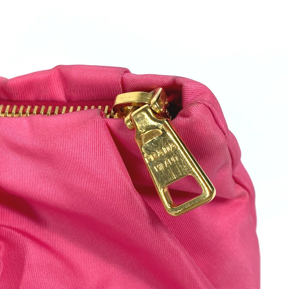 PRADA vintage pink bag featuring a gold zipper for a chic and stylish look