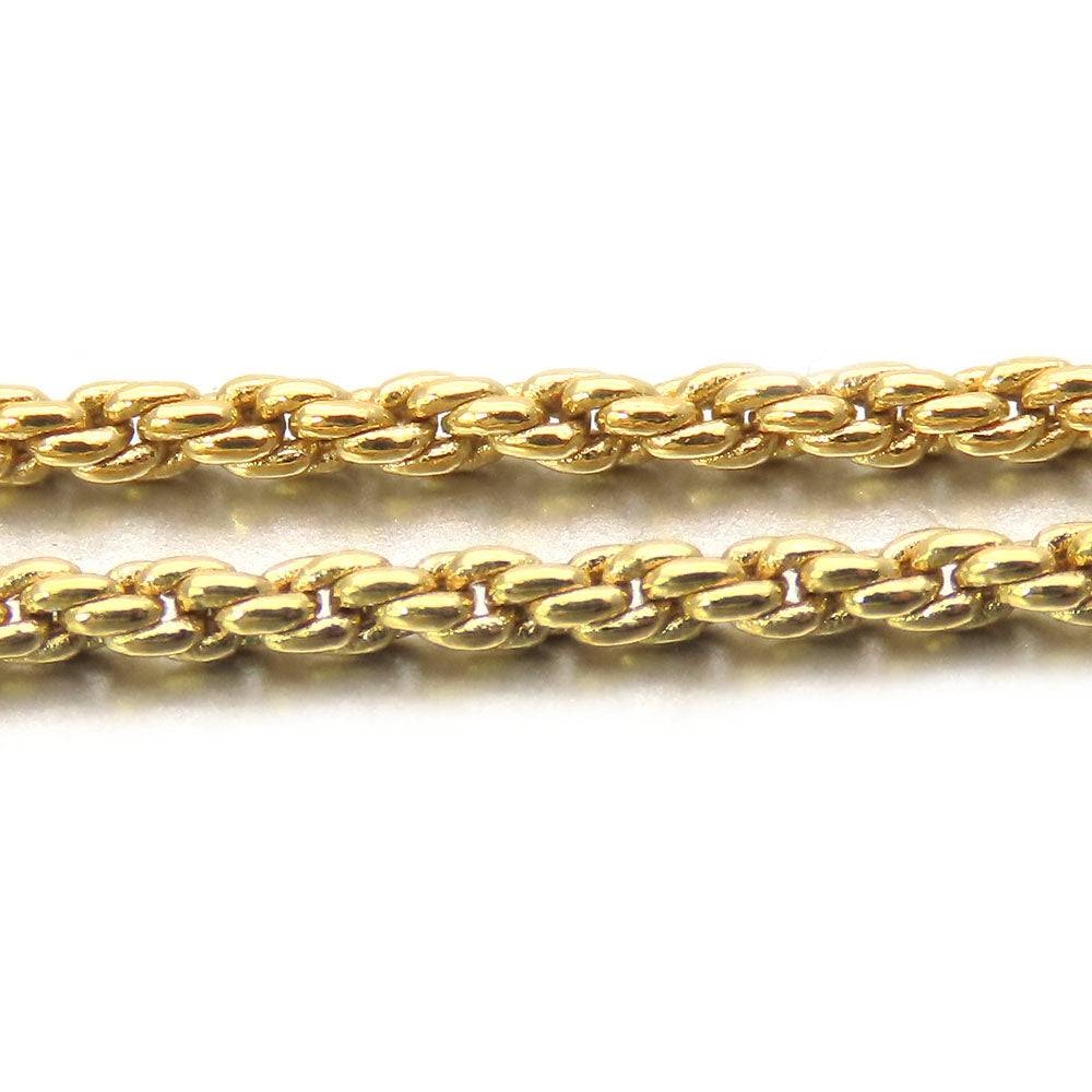 Close-up of pre-loved Christian Dior gold chain jewelry with intricate link design