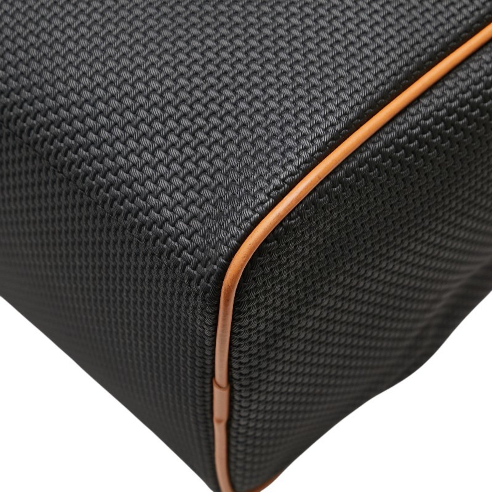 Close-up of the pre-loved Saint Laurent mini Boston bag featuring textured black fabric and cognac accents